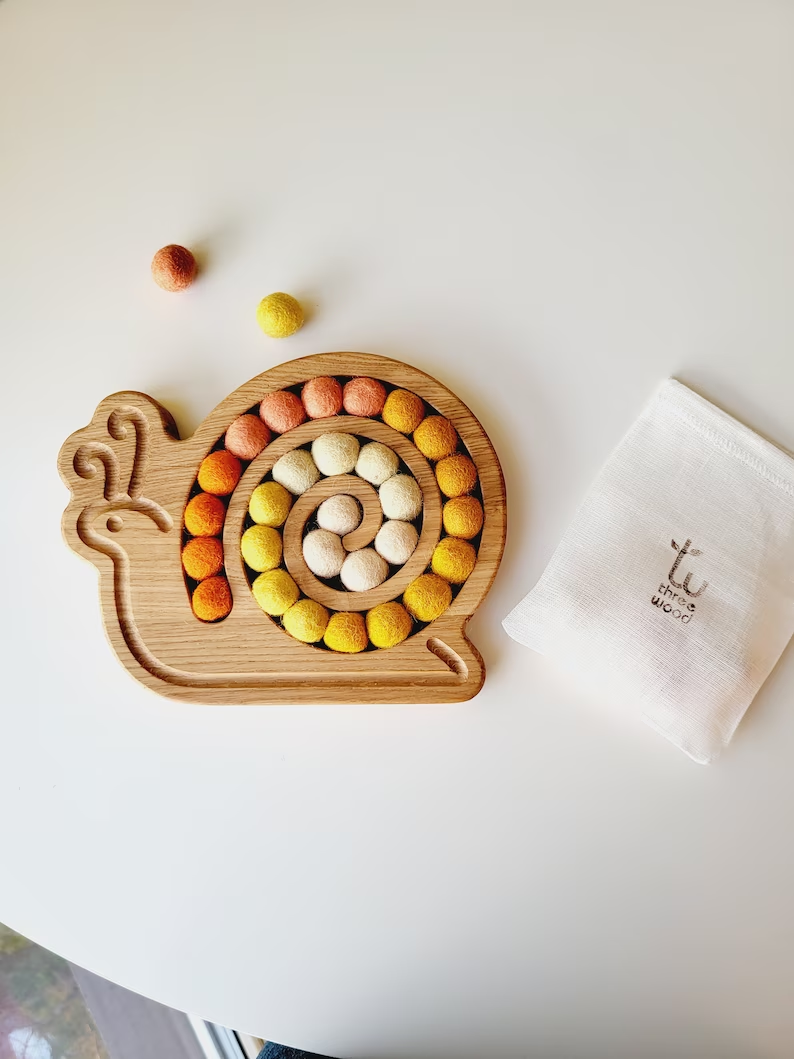 Wooden snail for fine motor skills activities