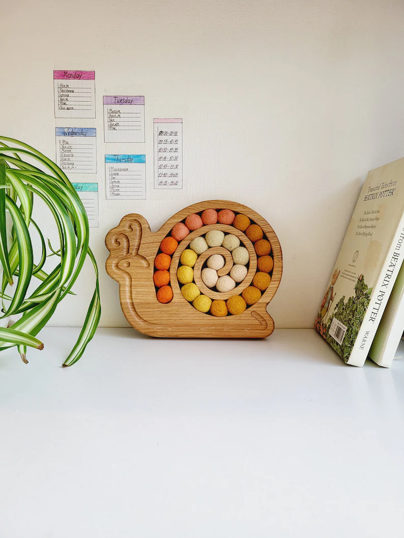 Wooden snail for fine motor skills activities