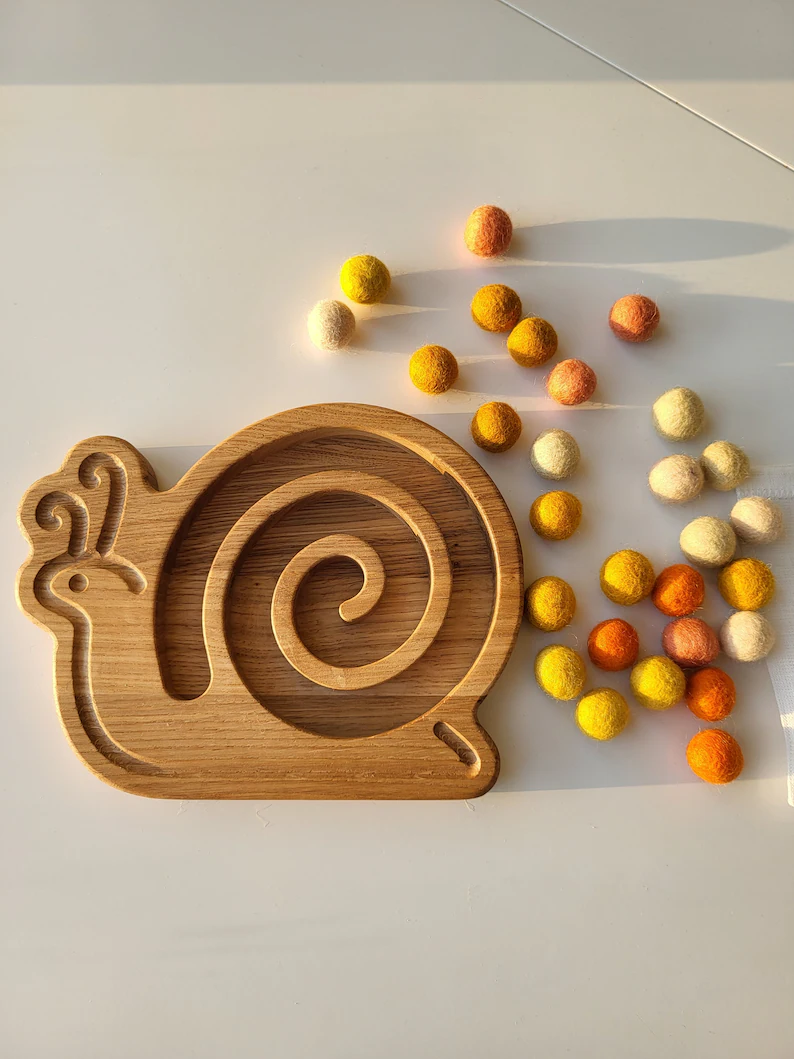 Wooden snail for fine motor skills activities