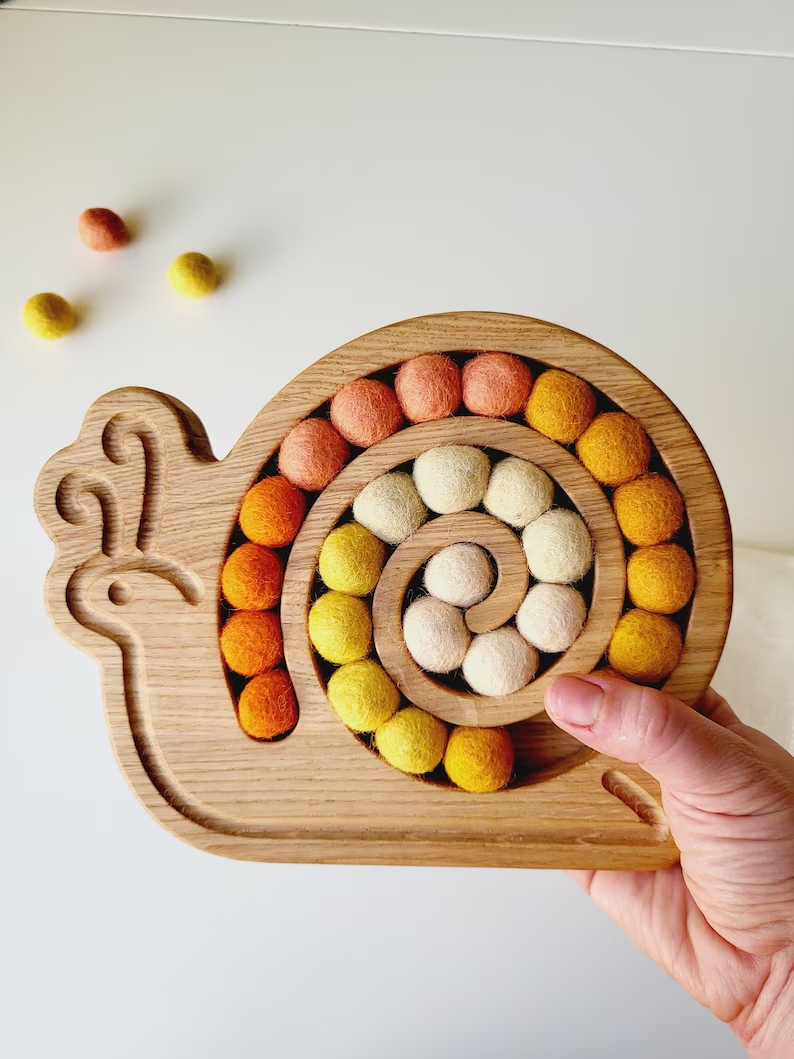 Wooden snail for fine motor skills activities