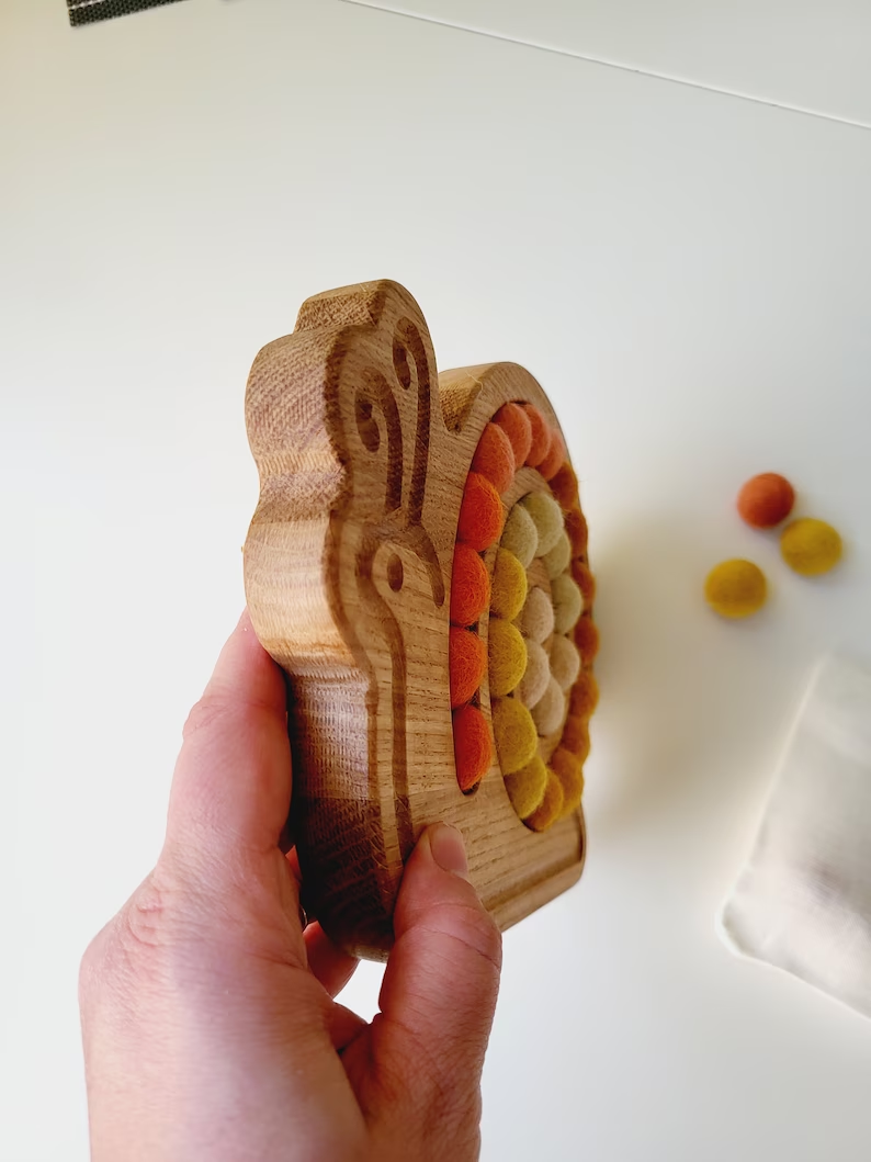 Wooden snail for fine motor skills activities