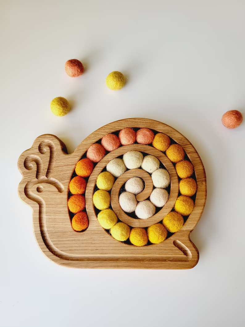 Wooden snail for fine motor skills activities