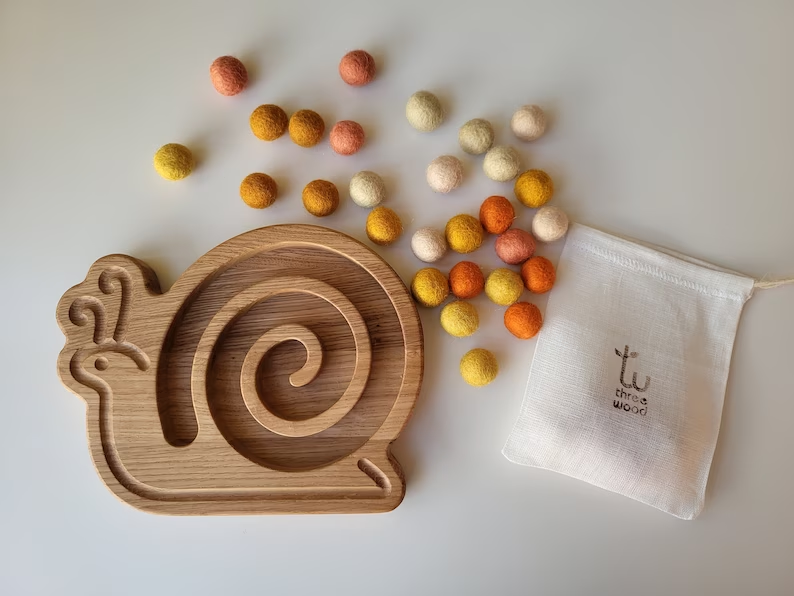 Wooden snail for fine motor skills activities