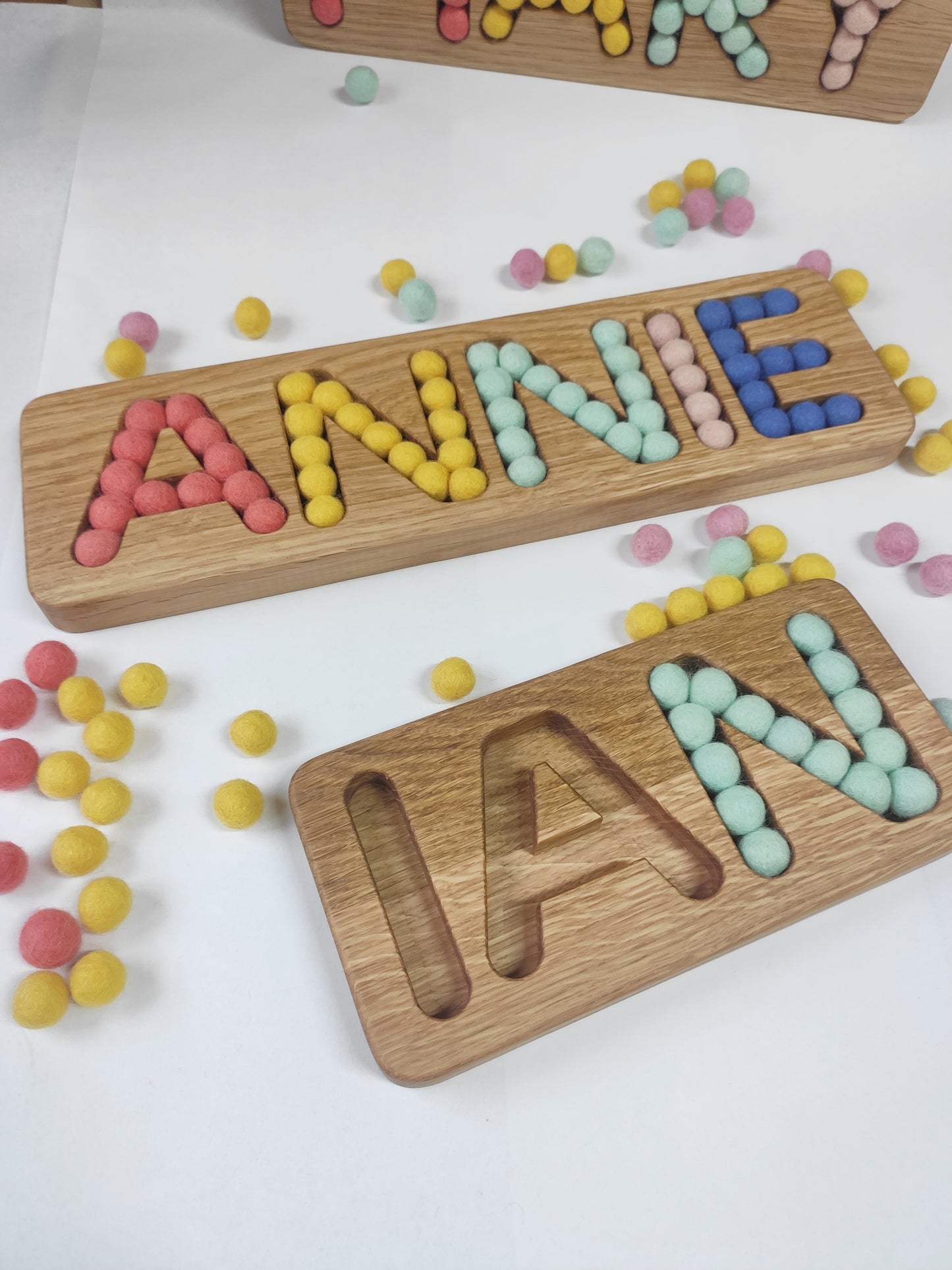 Wooden name board with felt balls