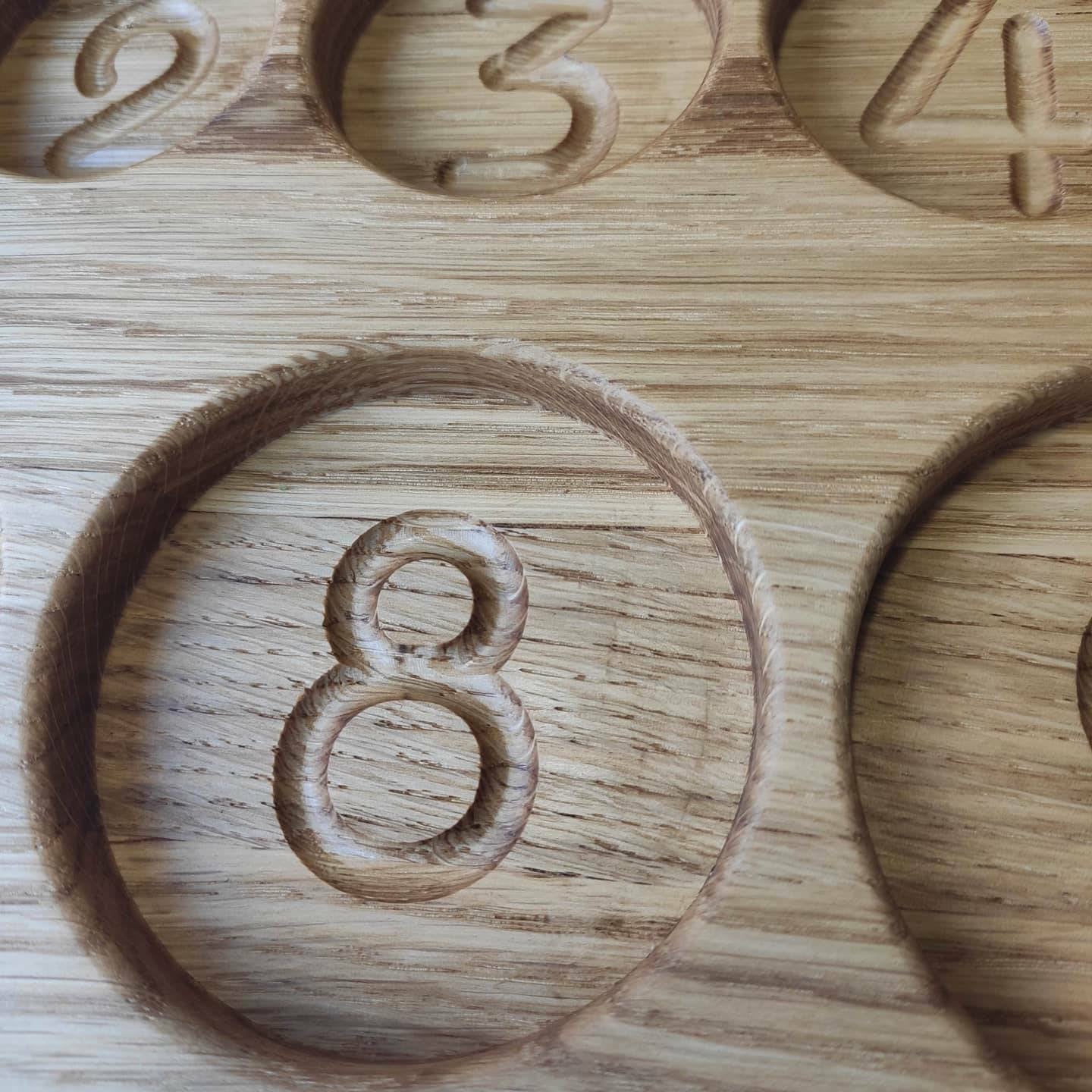 Montessori sorting tray with round sections, with numbers 1-10