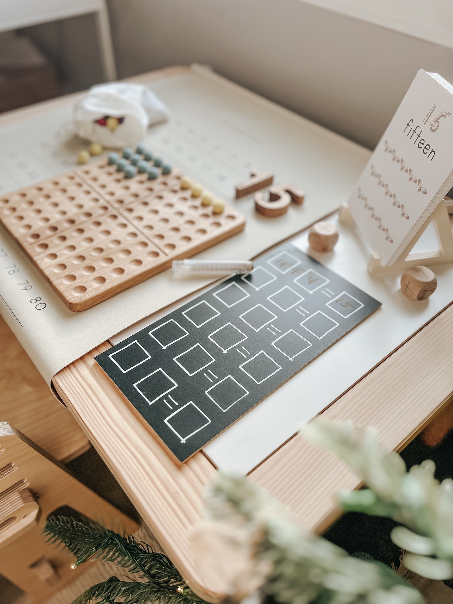 Montessori hundred board with numbers 1-100 and felt balls