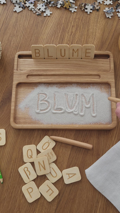Sand tray with German letters cards