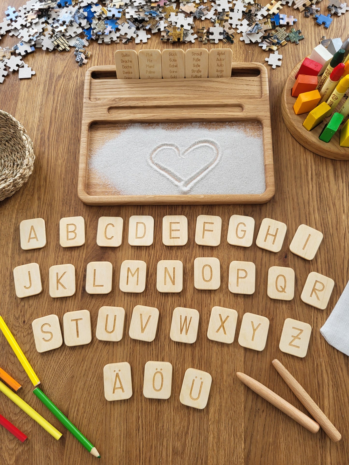 Sand tray with German letters cards