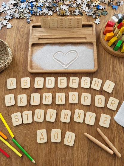 Sand tray with German letters cards