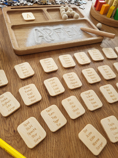 Sand tray with German letters cards