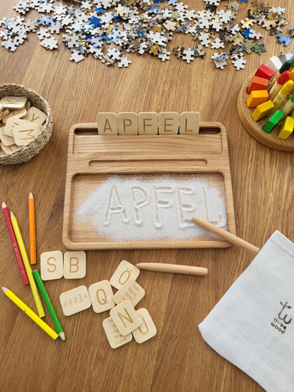 Sand tray with German letters cards