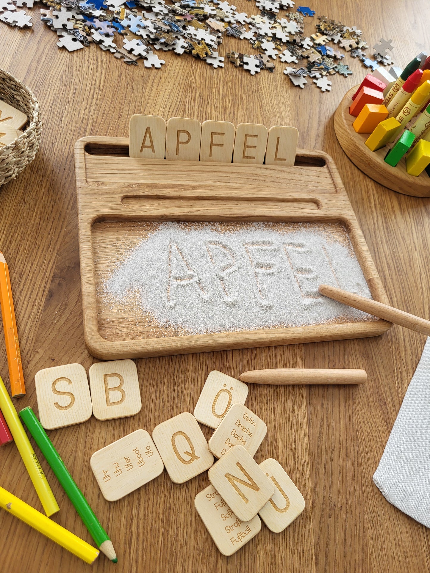 Sand tray with German letters cards