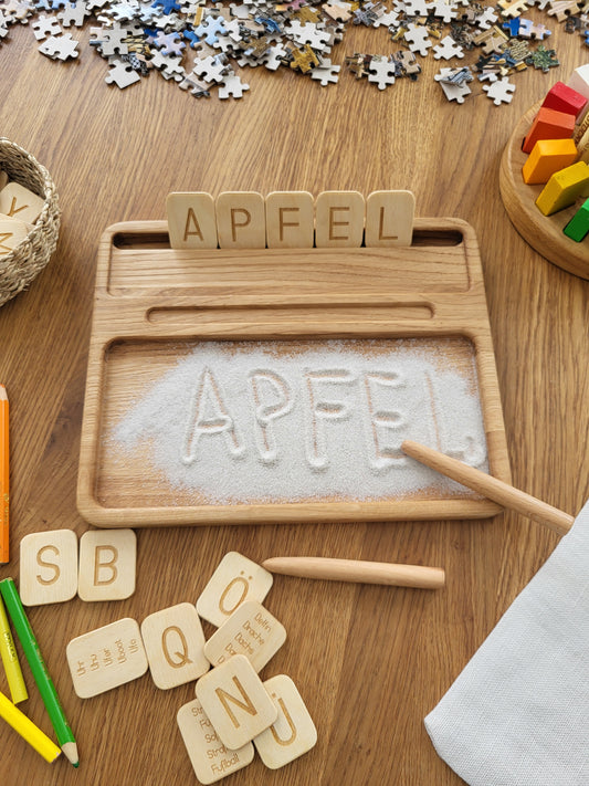 Sand tray with German letters cards