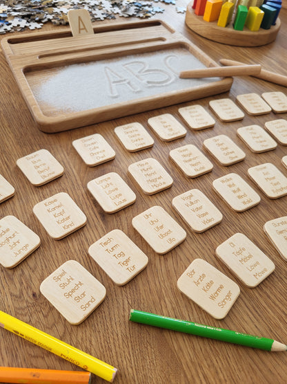 Sand tray with German letters cards