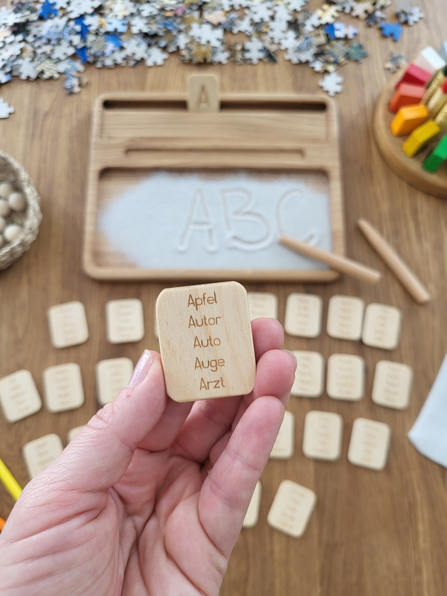 Sand tray with German letters cards