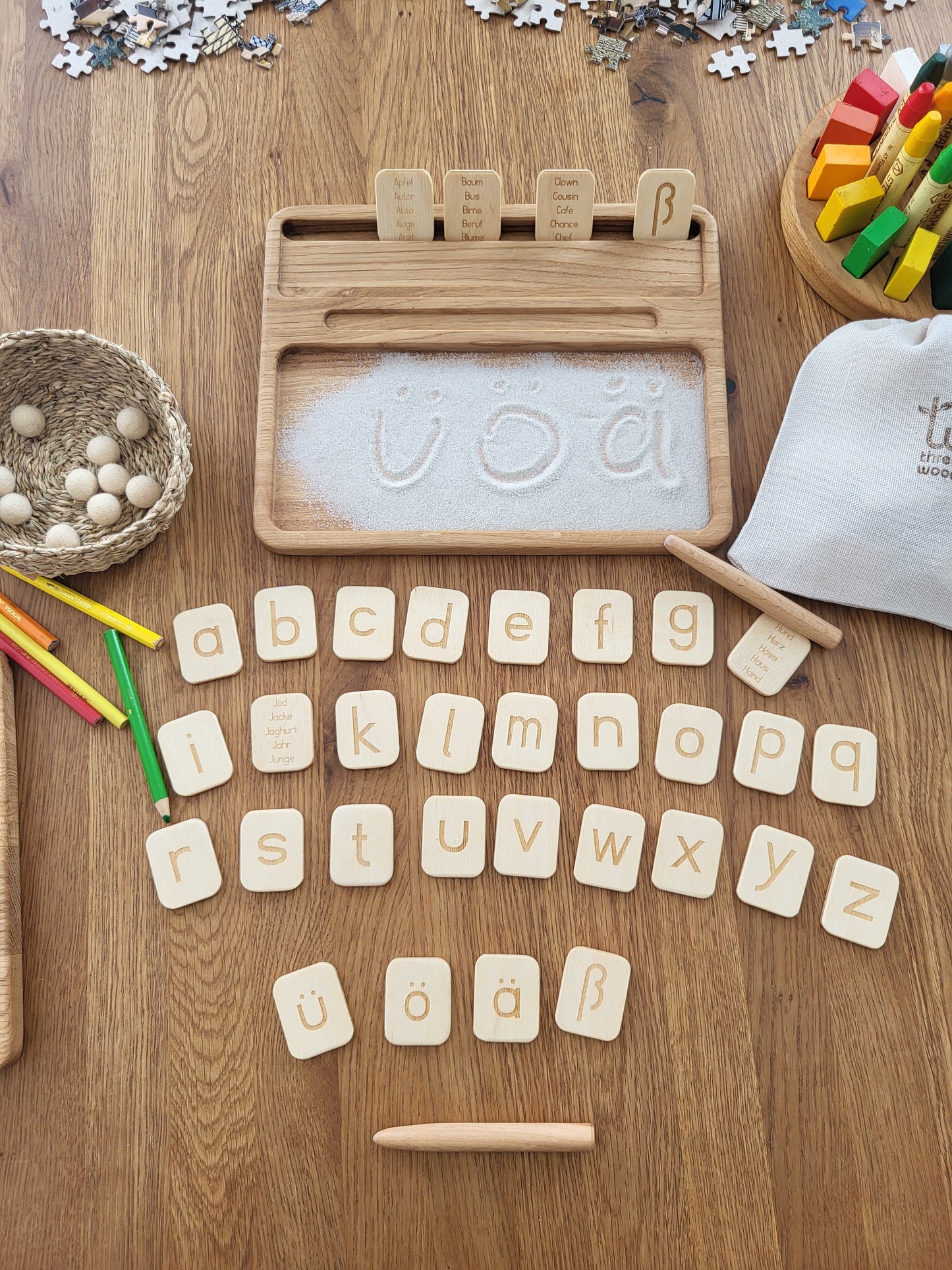 Sand tray with German letters cards