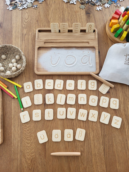 Sand tray with German letters cards